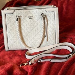 I’m selling this Guess purse! Beige ish color with silver metal.